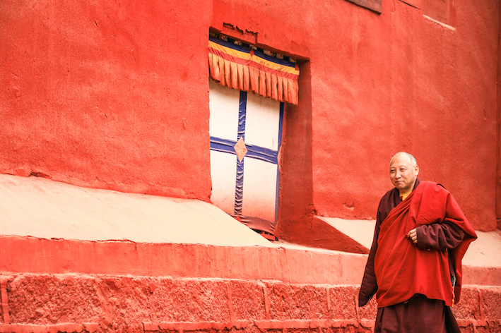 17.- Monk walking around Parkhang Temple